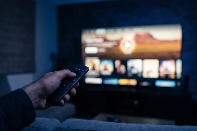 Remote control scrolling the IPPlayTV catch-up and on-demand menu during a free IPTV trial